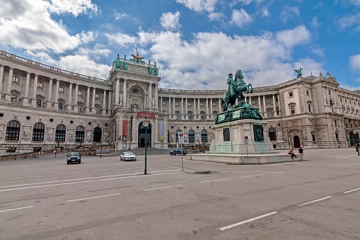 Vienna, Austria - August 14, 2010: Older castle sections (left), Neue Burg section (center of image) and Outer Castle Gate (separate on the right), in foreground the Heldenplatz.