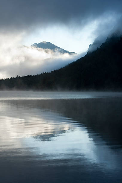 istock Misty sunrise at Lake Plansee - vertical 156024192
