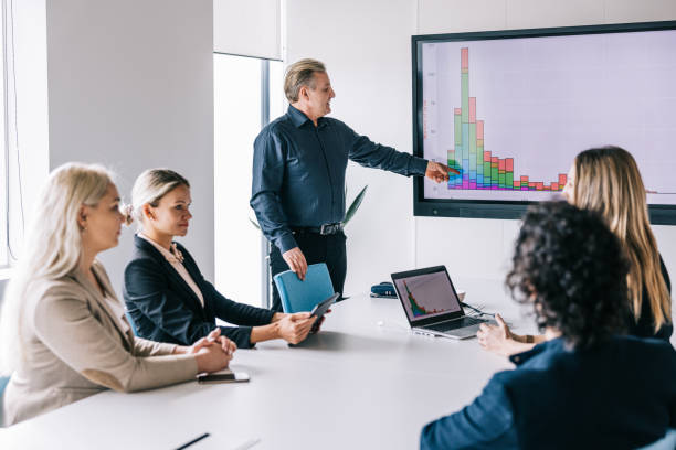istock Businessman making a presentation for his team 1560252109