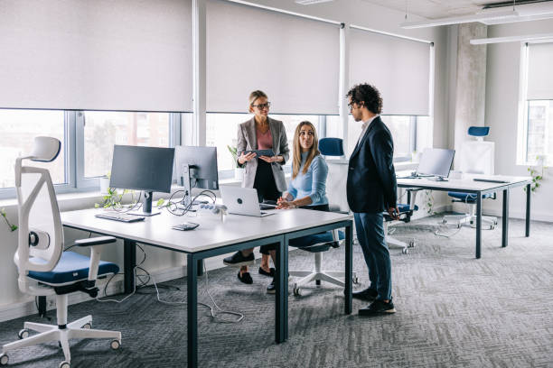 istock Financial colleagues collaborating together on a project 1560252123