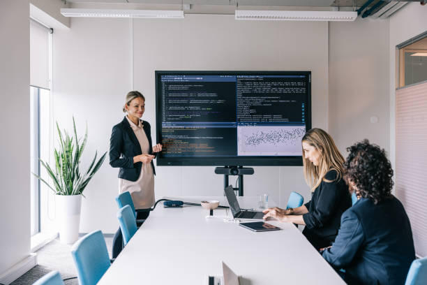 istock A group of Software developers working together at a team meeting 1560252124