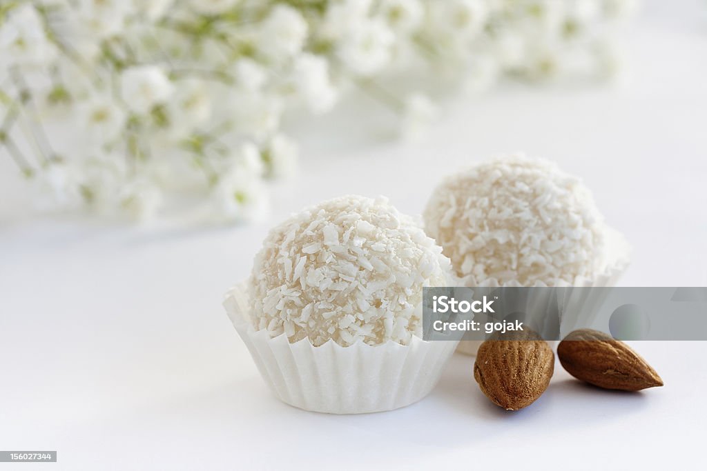 White coconut truffles White sweet coconut truffles, close up Almond Stock Photo