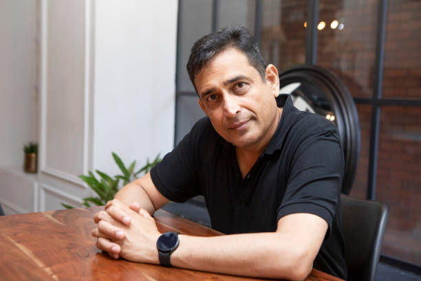 istock One mature man sitting at a table 1560274251