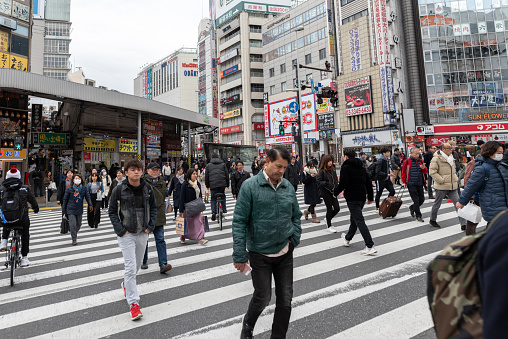 Tokyo, Japan - February 5, 2019: Tokyo Cityscape. People walks on Crossing. Shinjuku area. Japan