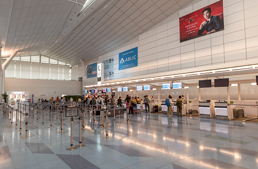 Tokyo, Japan - February 6, 2019: Tokyo International Haneda Airport. Departure Area with Check-in desks and People. Japan
