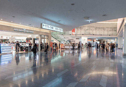 Tokyo, Japan - February 6, 2019: Tokyo International Haneda Airport. Departure Area with Duty Free Shops and People. Japan