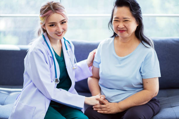 istock Happy Doctor with senior patient 1560297505
