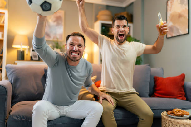 istock Male friends watching a soccer game and feeling enthusiastic. 1560302370