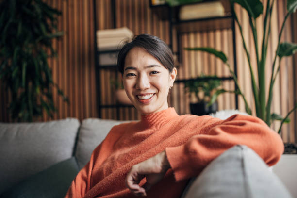 istock Woman sitting at home 1560340085