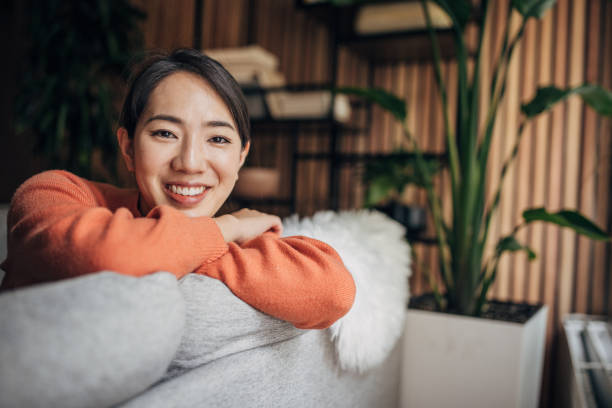 istock Woman sitting at home 1560341152