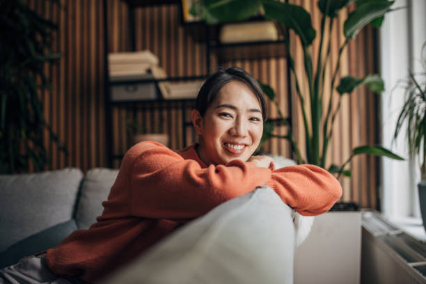 istock Woman sitting at home 1560341717