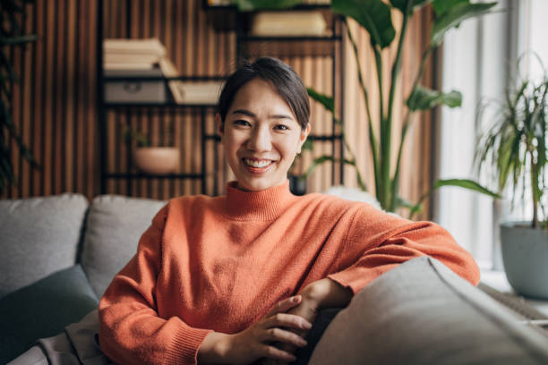 istock Woman sitting at home 1560342806