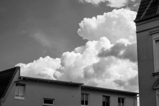 Massive cloud formation over the roofs of houses