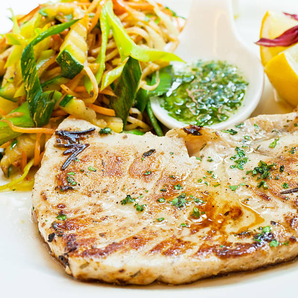istock Sworfish steak with steamed vegetables and spices 156036100