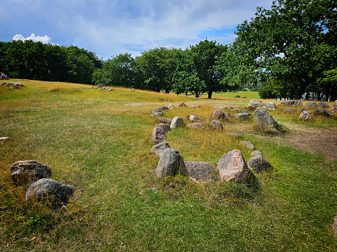 burial ground from the Viking Age or the Middle Ages with tombstones strewn over the field