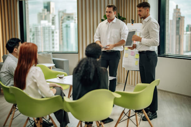istock In diverse workspace, project manager presents eco-friendly solar panels, and sustainable solutions 1560382156
