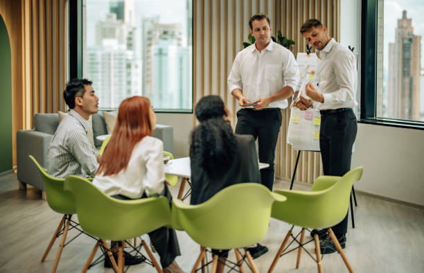istock In diverse workspace, project manager presents eco-friendly solar panels, and sustainable solutions 1560382157