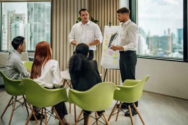 istock In diverse workspace, project manager presents eco-friendly solar panels, and sustainable solutions 1560383205