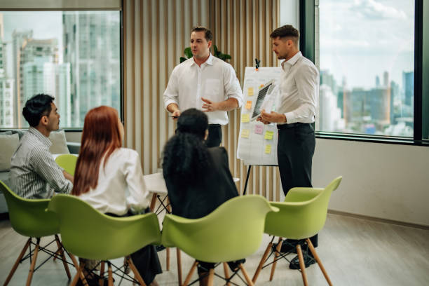 istock In diverse workspace, project manager presents eco-friendly solar panels, and sustainable solutions 1560383206
