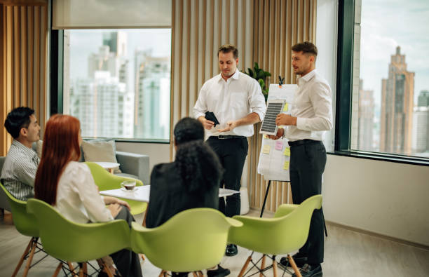 istock In diverse workspace, project manager presents eco-friendly solar panels, and sustainable solutions 1560383209