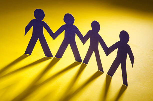 istock Paper people in teamworking concept 156038359