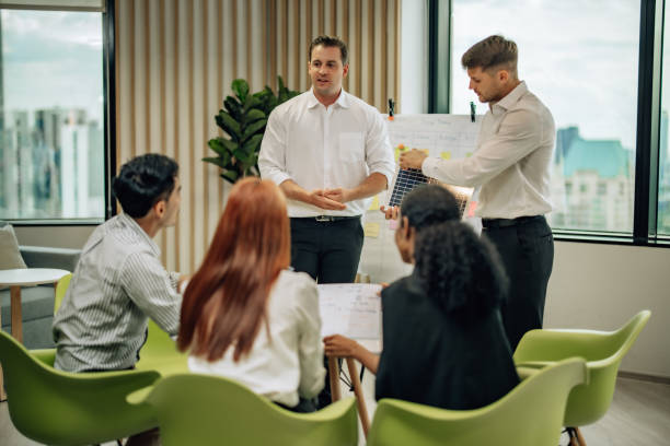 istock In diverse workspace, project manager presents eco-friendly solar panels, and sustainable solutions 1560384881