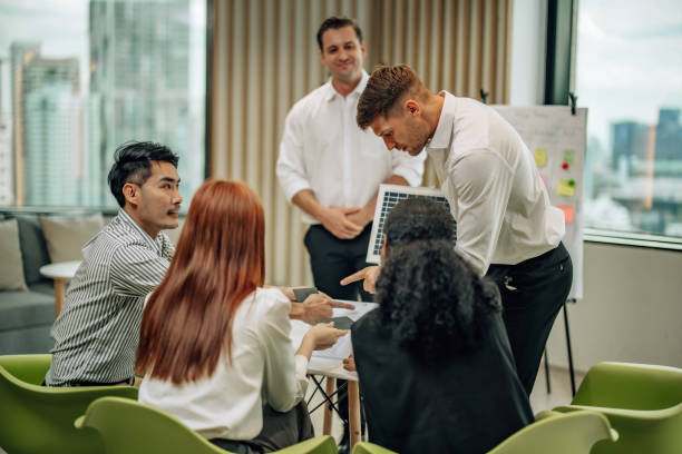 istock In diverse workspace, project manager presents eco-friendly solar panels, and sustainable solutions 1560385630