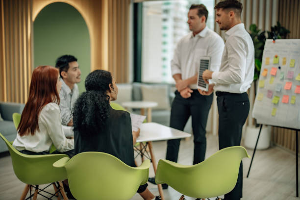 istock In diverse workspace, project manager presents eco-friendly solar panels, and sustainable solutions 1560385683
