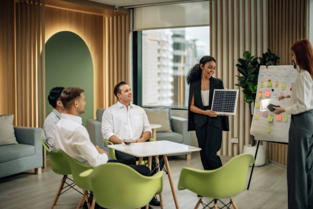 istock In diverse workspace, project manager presents eco-friendly solar panels, and sustainable solutions 1560386008