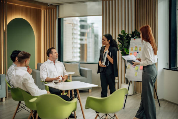 istock In diverse workspace, project manager presents eco-friendly solar panels, and sustainable solutions 1560386559