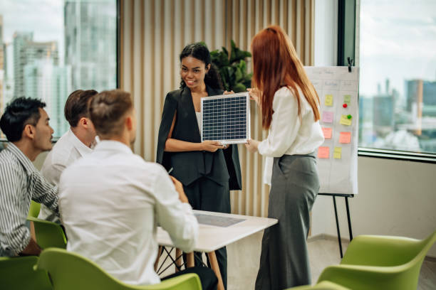 istock In diverse workspace, project manager presents eco-friendly solar panels, and sustainable solutions 1560386573
