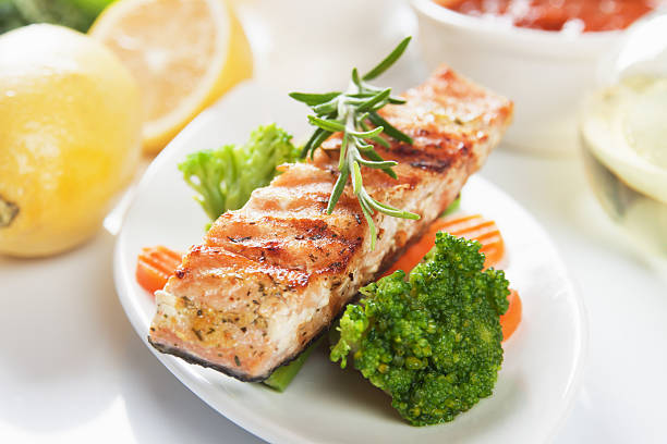 istock Cooked, grilled salmon with steamed vegetables  156038687