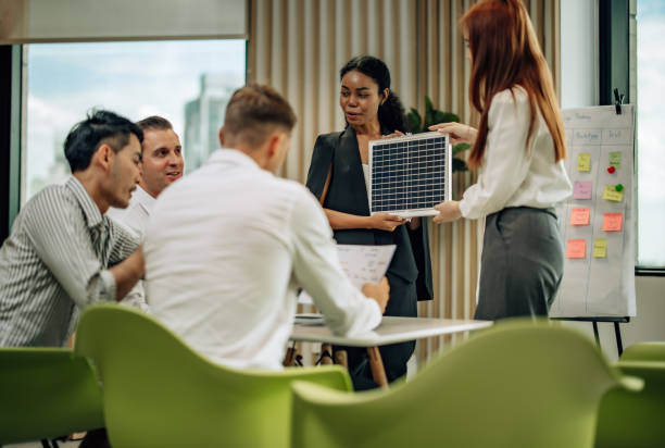 istock In diverse workspace, project manager presents eco-friendly solar panels, and sustainable solutions 1560387675