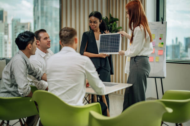 istock In diverse workspace, project manager presents eco-friendly solar panels, and sustainable solutions 1560387677