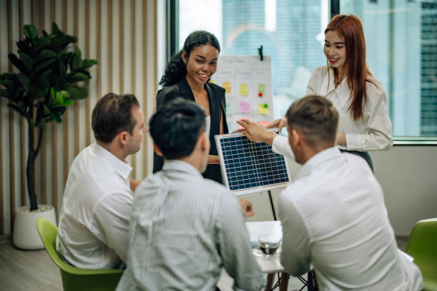 istock In diverse workspace, project manager presents eco-friendly solar panels, and sustainable solutions 1560389334