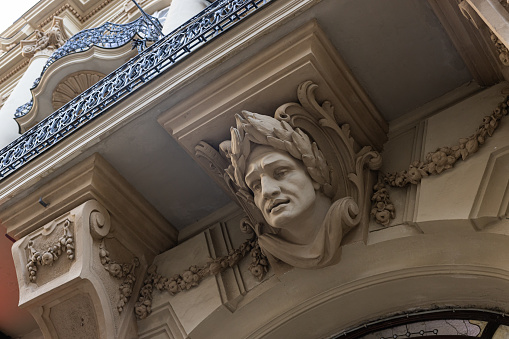 Closeup of ancient building, reliefs, caryatids