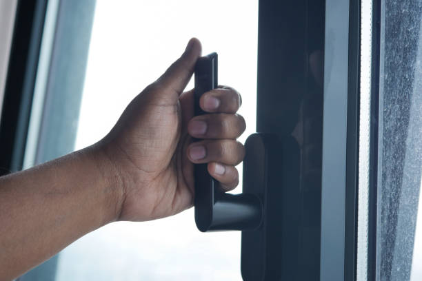 istock hand open gray plastic pvc window at home at early morning 1560441630