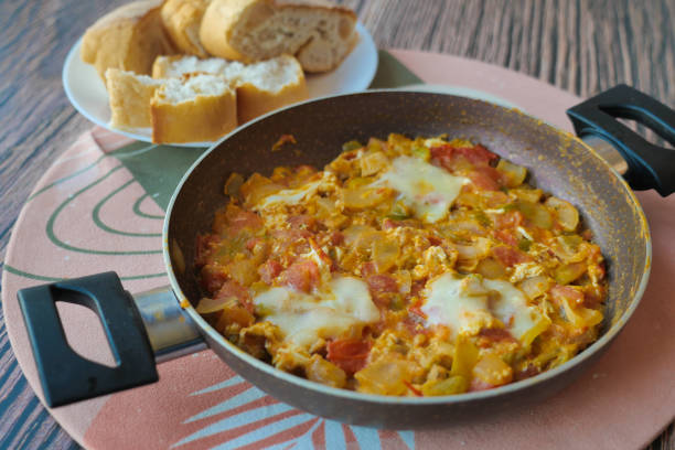 istock Turkish Menemen omelet in a frying pan. . 1560452219