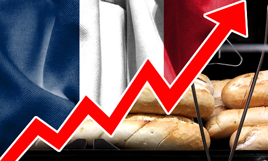 Double exposure of a big red arrow growing out of the French flag image. Bar graphs and charts. Food prices rise. Inflation concept. retail.