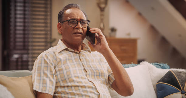 istock Elderly Man Using Phone, Calling and Talking: Reconnecting with Old Friends and Sharing Life Updates Remotely with Family. Old Person having Meaningful Conversations. Medium Close-up 1560469322