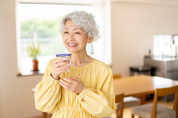 istock A senior woman is drinking water. 1560482187