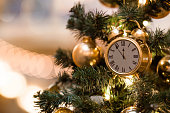 Countdown to midnight. The hours of the last moments before the New Year. The hands of the clock at five minutes to 12. Beautiful background for New year or Christmas 2024.