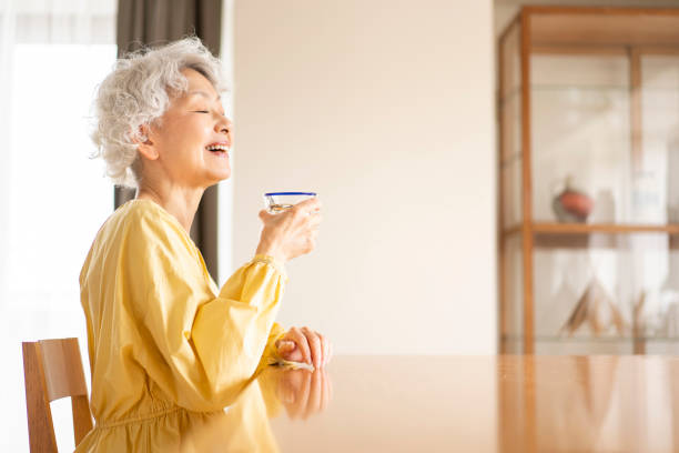 istock A senior woman is drinking. 1560482214