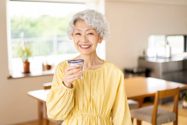 istock A senior woman is drinking water. 1560482215