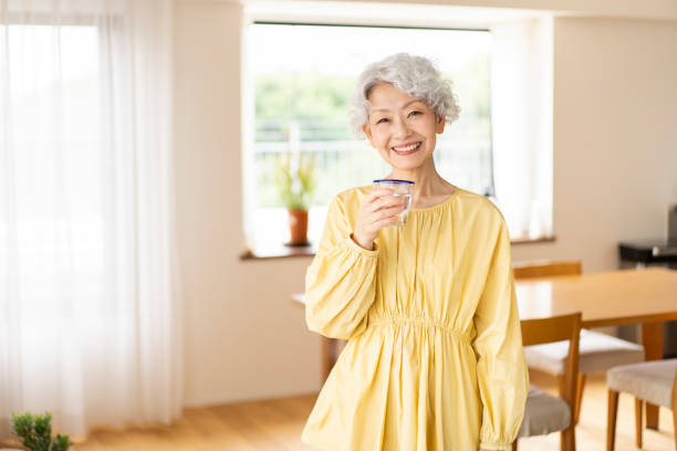 istock A senior woman is drinking water. 1560482733