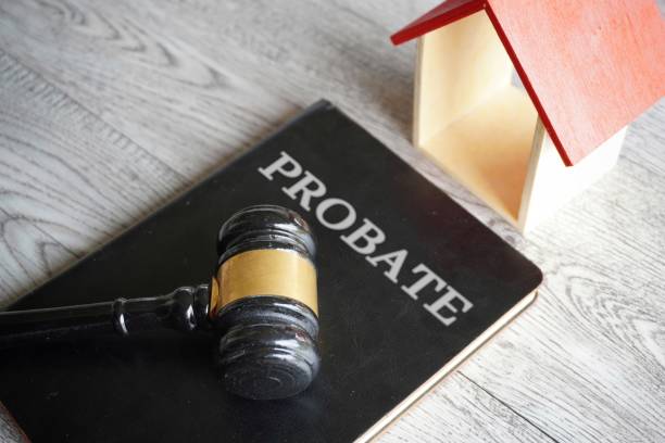 istock Toy house, gavel and text PROBATE. 1560517562