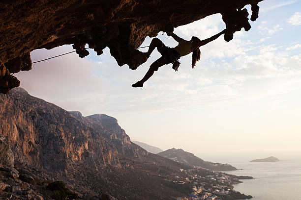 istock Female rock climber at sunset 156052703