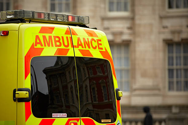 European style ambulance in front of building stock photo