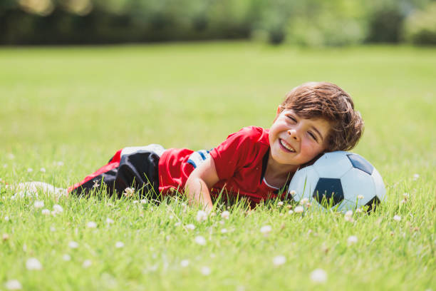 istock Young soccer player having fun on a field with ball 1560531647