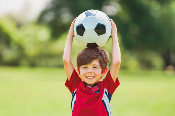 istock Young soccer player having fun on a field with ball 1560531655